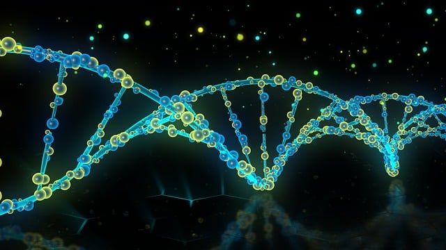 Blue and green DNA double helix on a black background. 